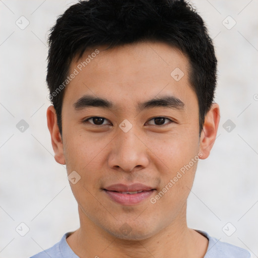 Joyful asian young-adult male with short  brown hair and brown eyes