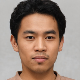 Neutral asian young-adult male with short  black hair and brown eyes