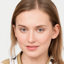 Joyful white young-adult female with long  brown hair and blue eyes