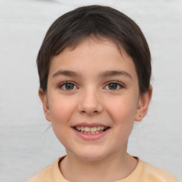 Joyful white child female with short  brown hair and brown eyes