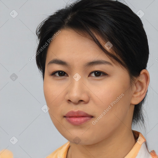 Joyful asian young-adult female with medium  brown hair and brown eyes