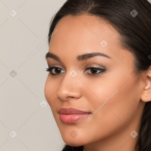 Joyful latino young-adult female with long  brown hair and brown eyes