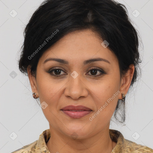 Joyful latino adult female with medium  brown hair and brown eyes