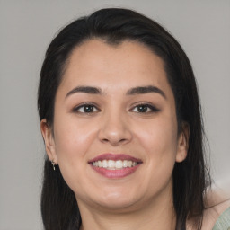 Joyful asian young-adult female with long  brown hair and brown eyes