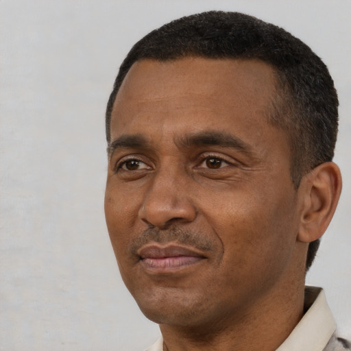 Neutral black adult male with short  black hair and brown eyes