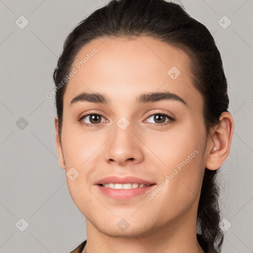 Joyful white young-adult female with short  brown hair and brown eyes