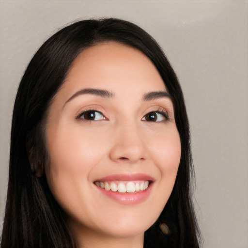 Joyful white young-adult female with long  black hair and brown eyes