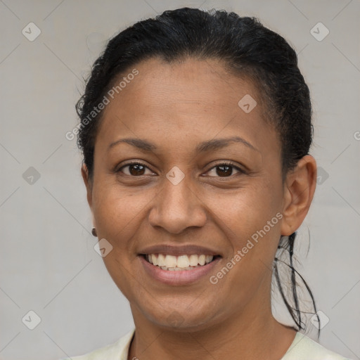 Joyful latino young-adult female with short  brown hair and brown eyes