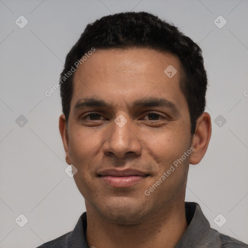 Joyful white young-adult male with short  black hair and brown eyes