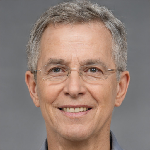 Joyful white middle-aged male with short  gray hair and grey eyes