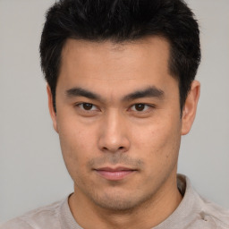 Neutral asian young-adult male with short  black hair and brown eyes