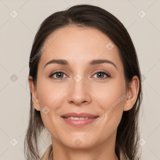 Joyful white young-adult female with medium  brown hair and grey eyes