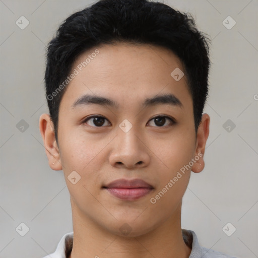 Joyful asian young-adult male with short  black hair and brown eyes