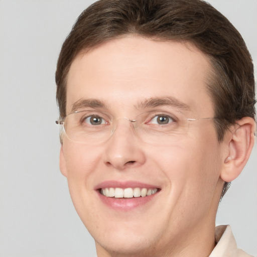 Joyful white adult male with short  brown hair and grey eyes