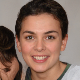 Joyful white young-adult female with medium  brown hair and blue eyes