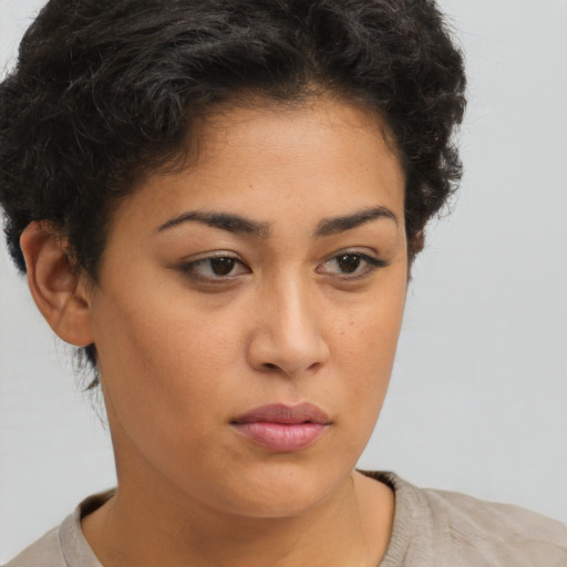 Neutral latino young-adult female with short  brown hair and brown eyes