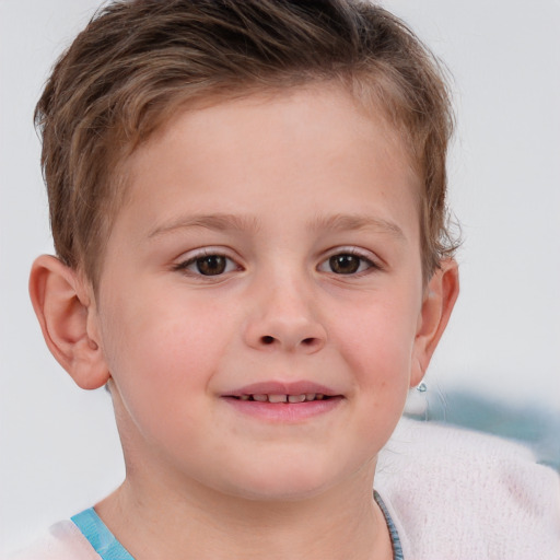 Joyful white child male with short  brown hair and brown eyes