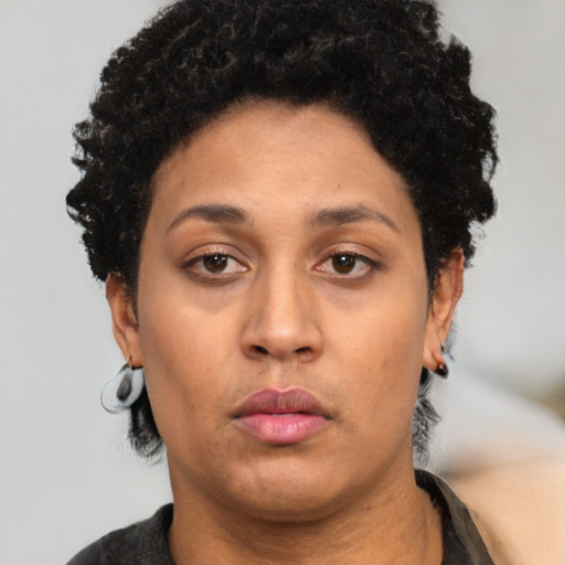 Neutral latino adult female with short  black hair and brown eyes