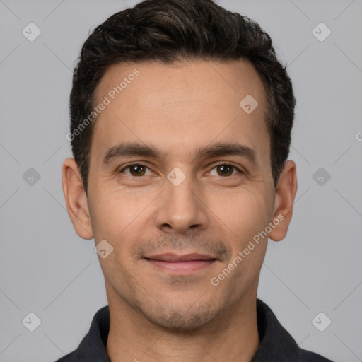 Joyful white young-adult male with short  black hair and brown eyes