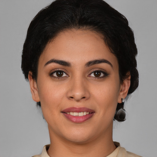 Joyful white young-adult female with medium  brown hair and brown eyes