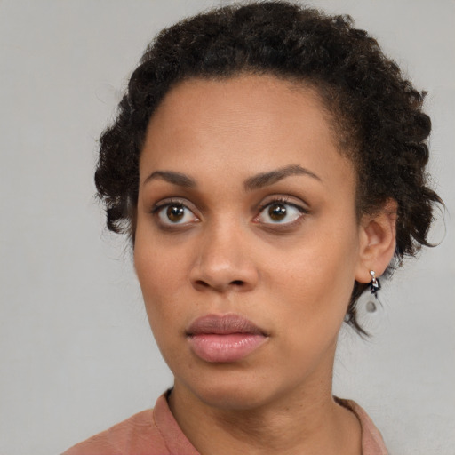 Neutral black young-adult female with short  brown hair and brown eyes