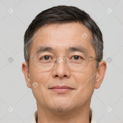 Joyful white adult male with short  brown hair and brown eyes