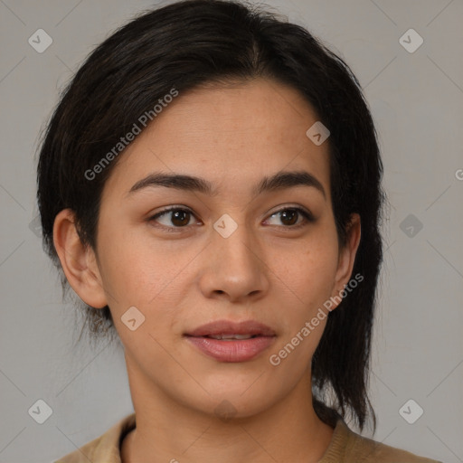 Joyful latino young-adult female with medium  brown hair and brown eyes