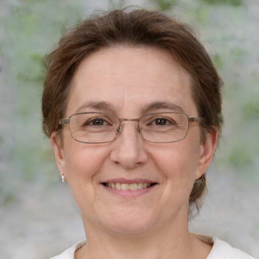 Joyful white middle-aged female with medium  brown hair and brown eyes