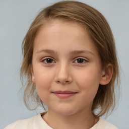 Joyful white child female with medium  brown hair and brown eyes