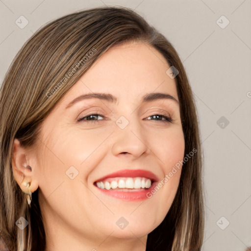 Joyful white young-adult female with long  brown hair and brown eyes