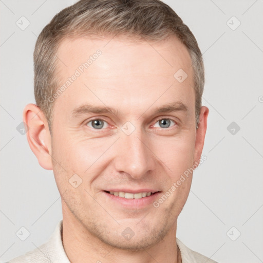 Joyful white adult male with short  brown hair and grey eyes