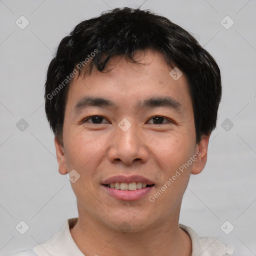 Joyful asian young-adult male with short  black hair and brown eyes