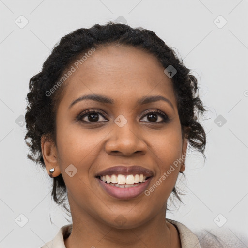 Joyful black young-adult female with long  black hair and brown eyes