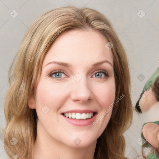 Joyful white young-adult female with medium  brown hair and green eyes