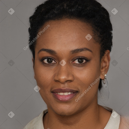 Joyful black young-adult female with short  black hair and brown eyes