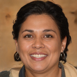 Joyful white adult female with medium  brown hair and brown eyes