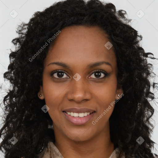 Joyful black young-adult female with long  brown hair and brown eyes