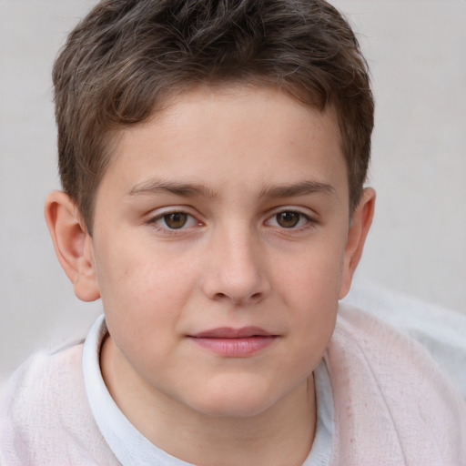 Joyful white child male with short  brown hair and brown eyes