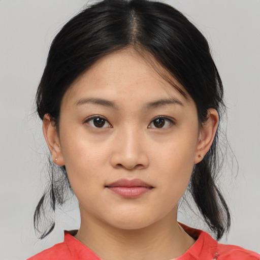 Joyful asian young-adult female with medium  black hair and brown eyes