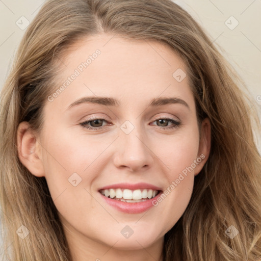 Joyful white young-adult female with long  brown hair and grey eyes