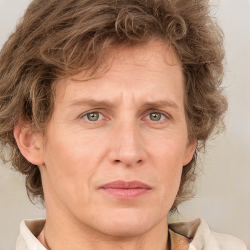 Joyful white adult male with medium  brown hair and grey eyes