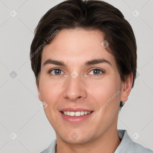 Joyful white young-adult female with short  brown hair and grey eyes