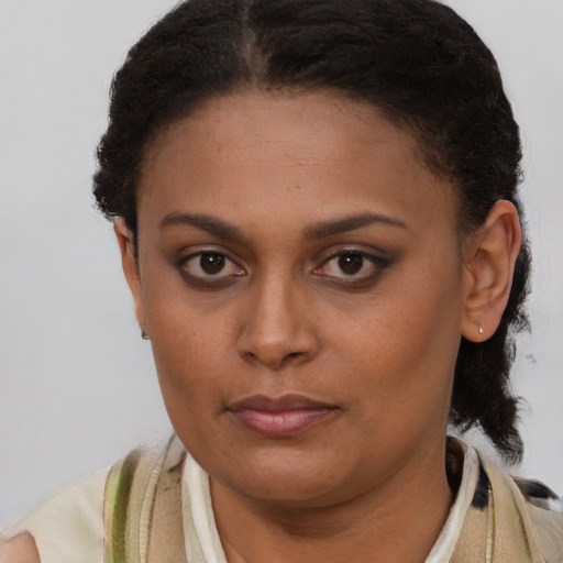 Neutral latino young-adult female with short  brown hair and brown eyes
