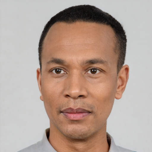 Neutral black adult male with short  black hair and brown eyes