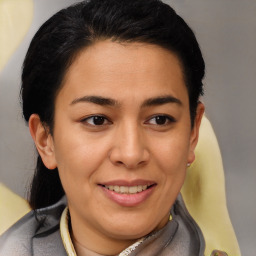 Joyful latino young-adult female with short  brown hair and brown eyes