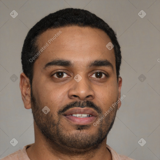 Joyful latino young-adult male with short  black hair and brown eyes