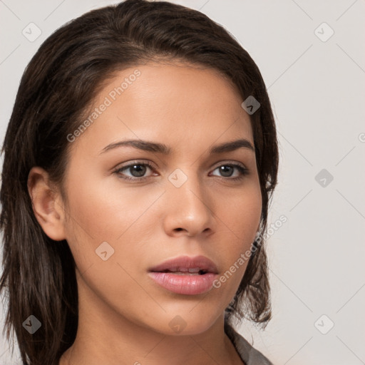 Neutral white young-adult female with long  brown hair and brown eyes