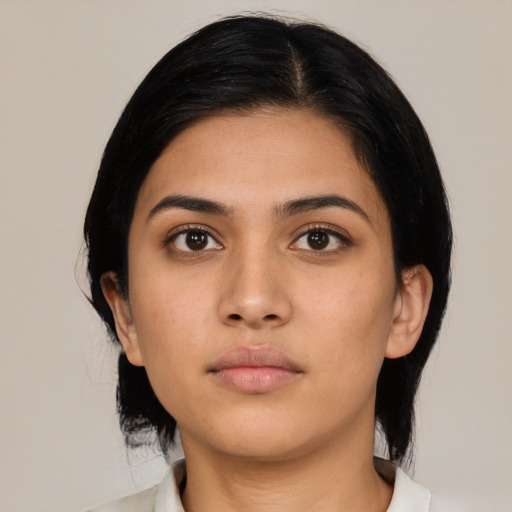 Neutral latino young-adult female with medium  black hair and brown eyes