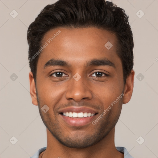 Joyful black young-adult male with short  brown hair and brown eyes