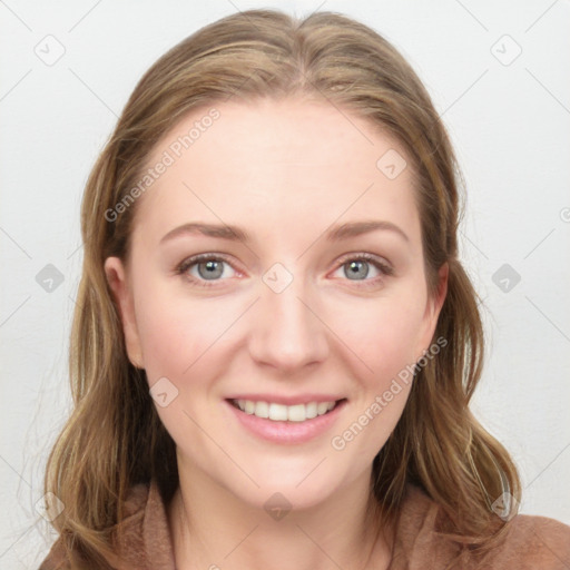 Joyful white young-adult female with long  brown hair and blue eyes